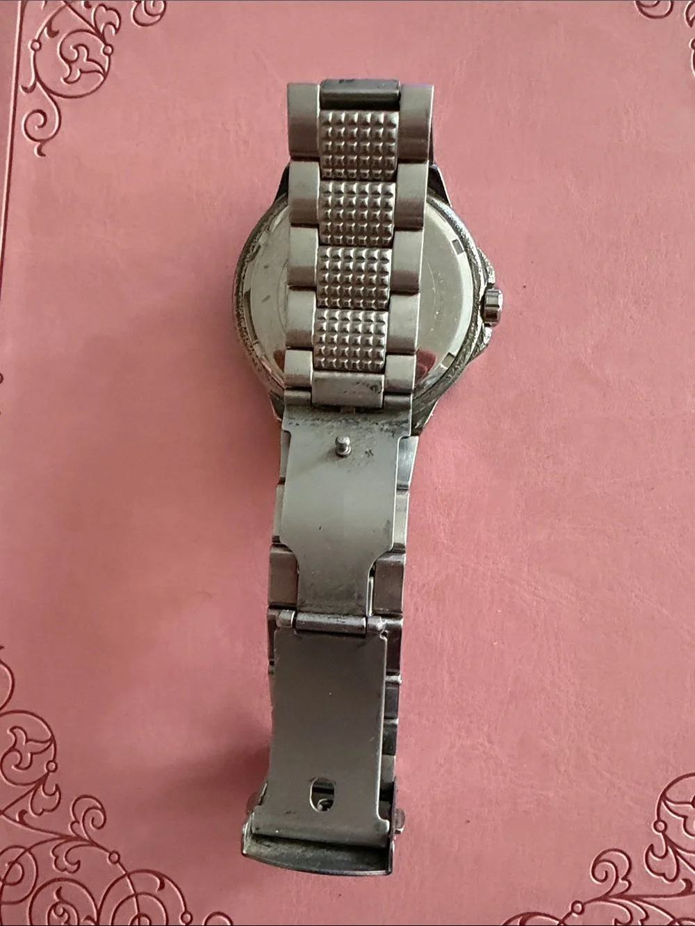 Watch on pink background